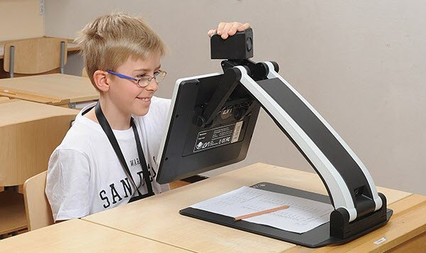 A student using a on screen magnifier to access the computer.